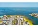 Expansive aerial view of waterfront location with tranquil, clear blue water and tropical foliage at 6531 Seaview Blvd, Hudson, FL 34667