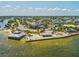 High-angle of beachfront with dining, parking, and community gathering spaces at 6531 Seaview Blvd, Hudson, FL 34667