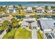 Inviting aerial view of waterfront home with solar panels, boat dock, and lush landscaping at 6531 Seaview Blvd, Hudson, FL 34667