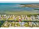 Wide aerial view of waterfront homes with boat access and stunning bay views at 6531 Seaview Blvd, Hudson, FL 34667