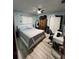 Cozy bedroom features a queen bed, ceiling fan, and ample storage space at 6531 Seaview Blvd, Hudson, FL 34667