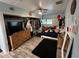 Bedroom featuring a bed, a large dresser, an open closet, and wood-look floors at 6531 Seaview Blvd, Hudson, FL 34667
