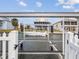 Canal-front property featuring a boat lift and beautiful views of neighboring waterfront homes at 6531 Seaview Blvd, Hudson, FL 34667