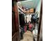 Walk-in closet featuring ample storage space, with shelving and clothing racks at 6531 Seaview Blvd, Hudson, FL 34667