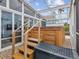 Inviting outdoor hot tub with screen enclosure and adjacent seating area perfect for relaxation at 6531 Seaview Blvd, Hudson, FL 34667