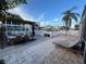 Inviting waterfront patio with a private boat dock, perfect for outdoor dining and relaxation at 6531 Seaview Blvd, Hudson, FL 34667