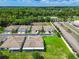 Aerial view of a residential neighborhood showcasing well-maintained homes, green spaces, and a tree-lined landscape at 6606 Pullen Ct, Tampa, FL 33625