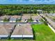A lovely aerial view of charming single-story homes, green spaces, and surrounding trees at 6606 Pullen Ct, Tampa, FL 33625