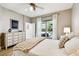 Bright bedroom with a neutral palette, and a view to the outside at 6606 Pullen Ct, Tampa, FL 33625