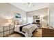 Cozy bedroom featuring a bed, nightstands, dresser, and a window with natural light at 6606 Pullen Ct, Tampa, FL 33625