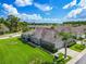 An aerial view of a well-kept home with lush green lawn and mature landscaping at 6606 Pullen Ct, Tampa, FL 33625