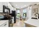 Beautiful kitchen with stainless steel appliances, white cabinets, and a charming breakfast nook area at 6606 Pullen Ct, Tampa, FL 33625