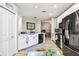 Bright kitchen features stainless steel appliances, white cabinets, and a black sink and faucet at 6606 Pullen Ct, Tampa, FL 33625