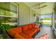 The screened lanai offers an inviting space with a comfortable lounge area and tranquil views at 6606 Pullen Ct, Tampa, FL 33625