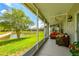 Enjoy the screened lanai with a cozy seating area and scenic views of the backyard pond at 6606 Pullen Ct, Tampa, FL 33625