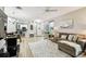 Open-concept living area with view to kitchen and front entrance at 6606 Pullen Ct, Tampa, FL 33625