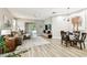 Bright and airy living space featuring wood-look floors and abundant natural light at 6606 Pullen Ct, Tampa, FL 33625