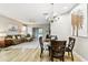 Bright and airy living space featuring wood-look floors and abundant natural light at 6606 Pullen Ct, Tampa, FL 33625