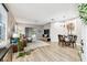 Bright and airy living space featuring wood-look floors and abundant natural light at 6606 Pullen Ct, Tampa, FL 33625