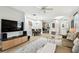 Spacious living room shows kitchen, dining room and front door at 6606 Pullen Ct, Tampa, FL 33625