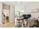 Home office with wood floors, work space, and view into adjacent kitchen area at 6606 Pullen Ct, Tampa, FL 33625