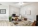 Office with wood desk, rug, and chair, illuminated by natural light and a ceiling fan at 6606 Pullen Ct, Tampa, FL 33625