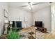 Bright office space with wood desk, area rug, neutral walls, and a ceiling fan at 6606 Pullen Ct, Tampa, FL 33625