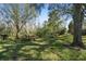 A serene community picnic area with picnic tables shaded by mature trees at 6606 Pullen Ct, Tampa, FL 33625
