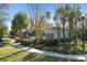 Community pool with black metal fence, shade covering and walking path at 6606 Pullen Ct, Tampa, FL 33625