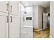 Modern shower with a glass enclosure, bench seat, and tiled niche for toiletries at 6606 Pullen Ct, Tampa, FL 33625