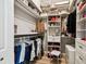 Walk-in closet with ample storage, built-in shelving, hanging racks, and a stool at 6606 Pullen Ct, Tampa, FL 33625
