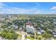 Aerial view of the condo building showing residential neighborhood, nearby streets and mature, lush landscaping at 700 Beach Ne Dr # 602, St Petersburg, FL 33701