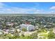 Wide aerial view highlighting the condo building with expansive neighborhood views and residential street access at 700 Beach Ne Dr # 602, St Petersburg, FL 33701