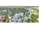 Aerial view of a well-maintained condo building, surrounded by lush trees and city streets at 700 Beach Ne Dr # 602, St Petersburg, FL 33701