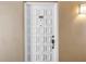 Apartment door with decorative panels and a knob, showing unit number 602 at 700 Beach Ne Dr # 602, St Petersburg, FL 33701