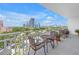 Charming balcony with bistro set offering stunning panoramic views of the city skyline at 700 Beach Ne Dr # 602, St Petersburg, FL 33701