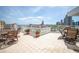 Expansive tiled balcony with outdoor furniture offering panoramic views of the city skyline and waterfront at 700 Beach Ne Dr # 602, St Petersburg, FL 33701