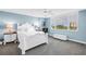 This bedroom features a neutral color scheme, carpeted floors, and a large window at 700 Beach Ne Dr # 602, St Petersburg, FL 33701