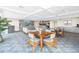 The clubhouse offers tables, chairs and a sofa with views overlooking the city and the kitchen at 700 Beach Ne Dr # 602, St Petersburg, FL 33701
