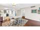 The dining room includes a white dining table and chairs, with a view into the bright kitchen area at 700 Beach Ne Dr # 602, St Petersburg, FL 33701