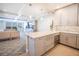 Open-concept kitchen with gray cabinets, stainless appliances, granite counters, and easy access to the living area at 700 Beach Ne Dr # 602, St Petersburg, FL 33701