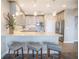 Modern kitchen features gray cabinets, granite countertops, stainless appliances, and a breakfast bar with seating at 700 Beach Ne Dr # 602, St Petersburg, FL 33701