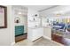 Bright kitchen featuring white cabinetry, marble countertops, and an open layout, offering a stylish and functional space at 700 Beach Ne Dr # 602, St Petersburg, FL 33701