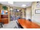 Library showcasing a large table, extensive bookshelves, and a door labeled 'Library' for reading at 700 Beach Ne Dr # 602, St Petersburg, FL 33701
