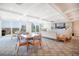 Bright living room featuring stylish furniture, a large TV, and expansive windows with city views at 700 Beach Ne Dr # 602, St Petersburg, FL 33701