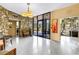 The building's lobby with stone accent wall, terrazzo floor, chandelier, and seating at 700 Beach Ne Dr # 602, St Petersburg, FL 33701
