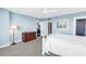 Bright main bedroom with carpet, lamp, bureau and ensuite entrance at 700 Beach Ne Dr # 602, St Petersburg, FL 33701