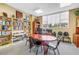 Office with a large wooden table, bookshelves filled with books, and a window providing natural light at 700 Beach Ne Dr # 602, St Petersburg, FL 33701