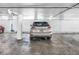 View of a Lexus SUV parked in well-lit underground garage with concrete floors and marked parking space at 700 Beach Ne Dr # 602, St Petersburg, FL 33701