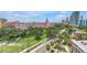 Charming street view showcases lush greenery, tropical palms and views of the Don CeSar Hotel at 700 Beach Ne Dr # 602, St Petersburg, FL 33701